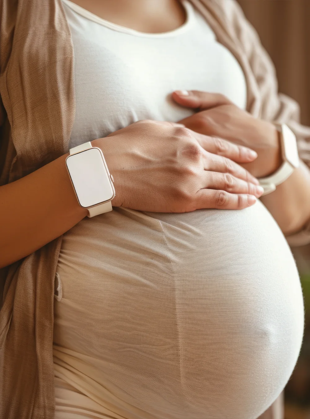 Close-up of a pregnant woman holding her belly Close-up of a pregnant woman holding her belly