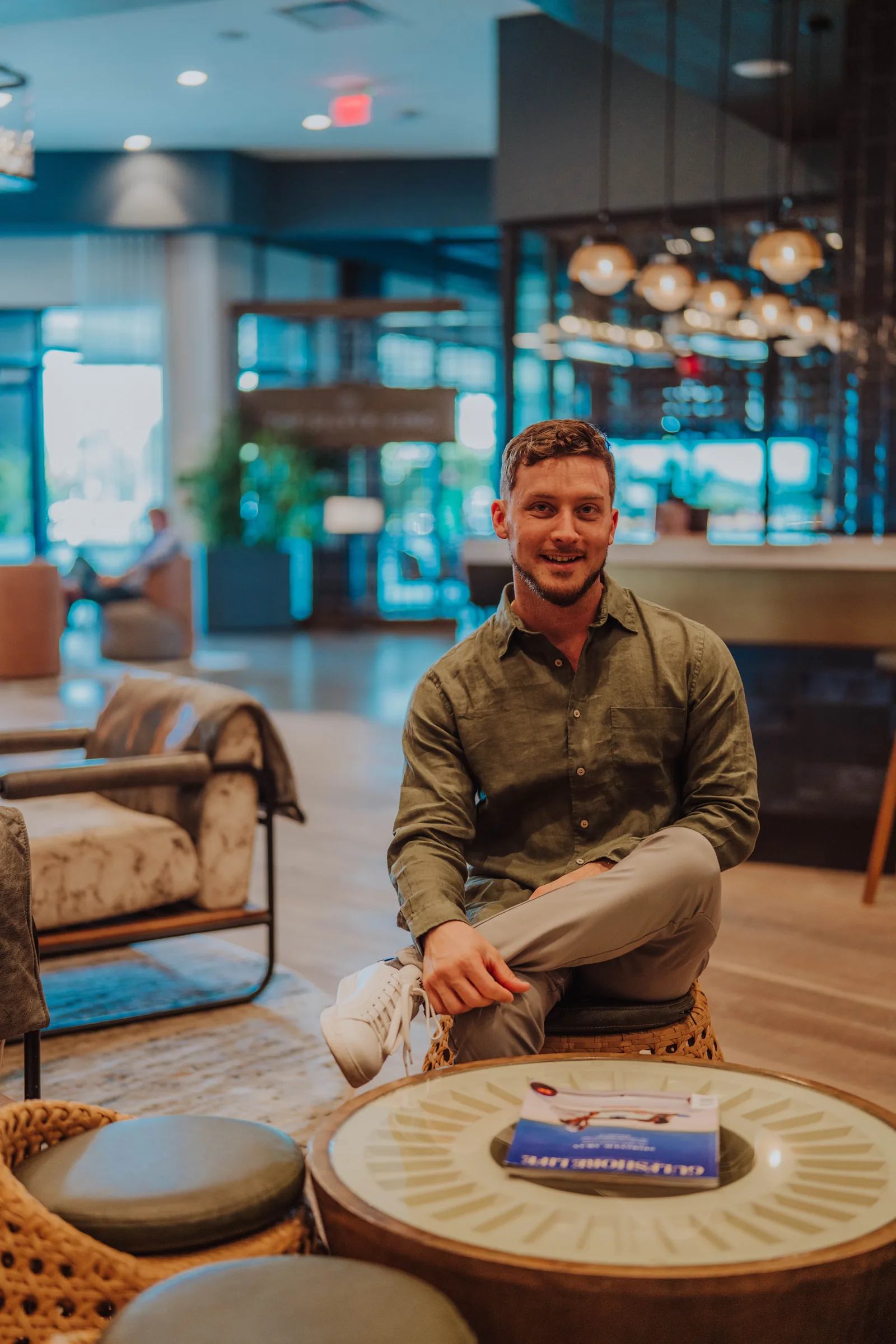 Dr. Jarod Ward seated in a lounge