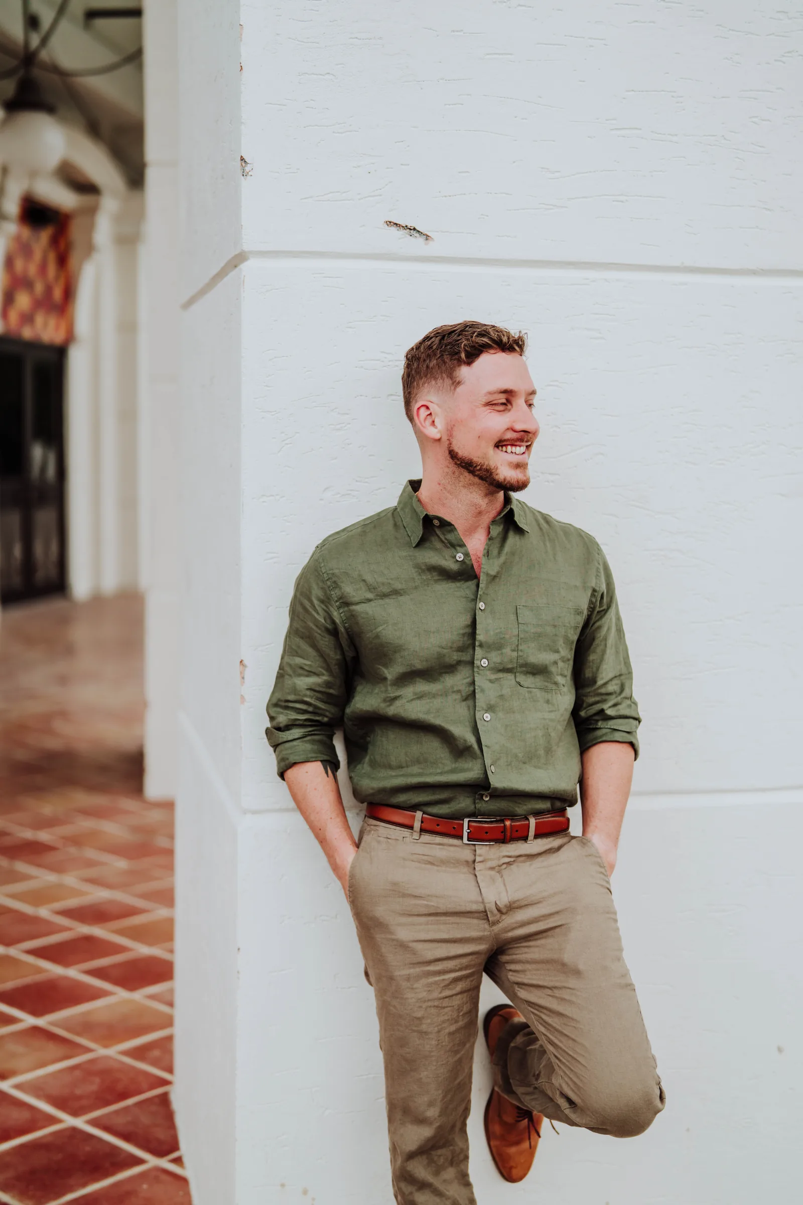 Dr. Jarod Ward leaning against a white wall