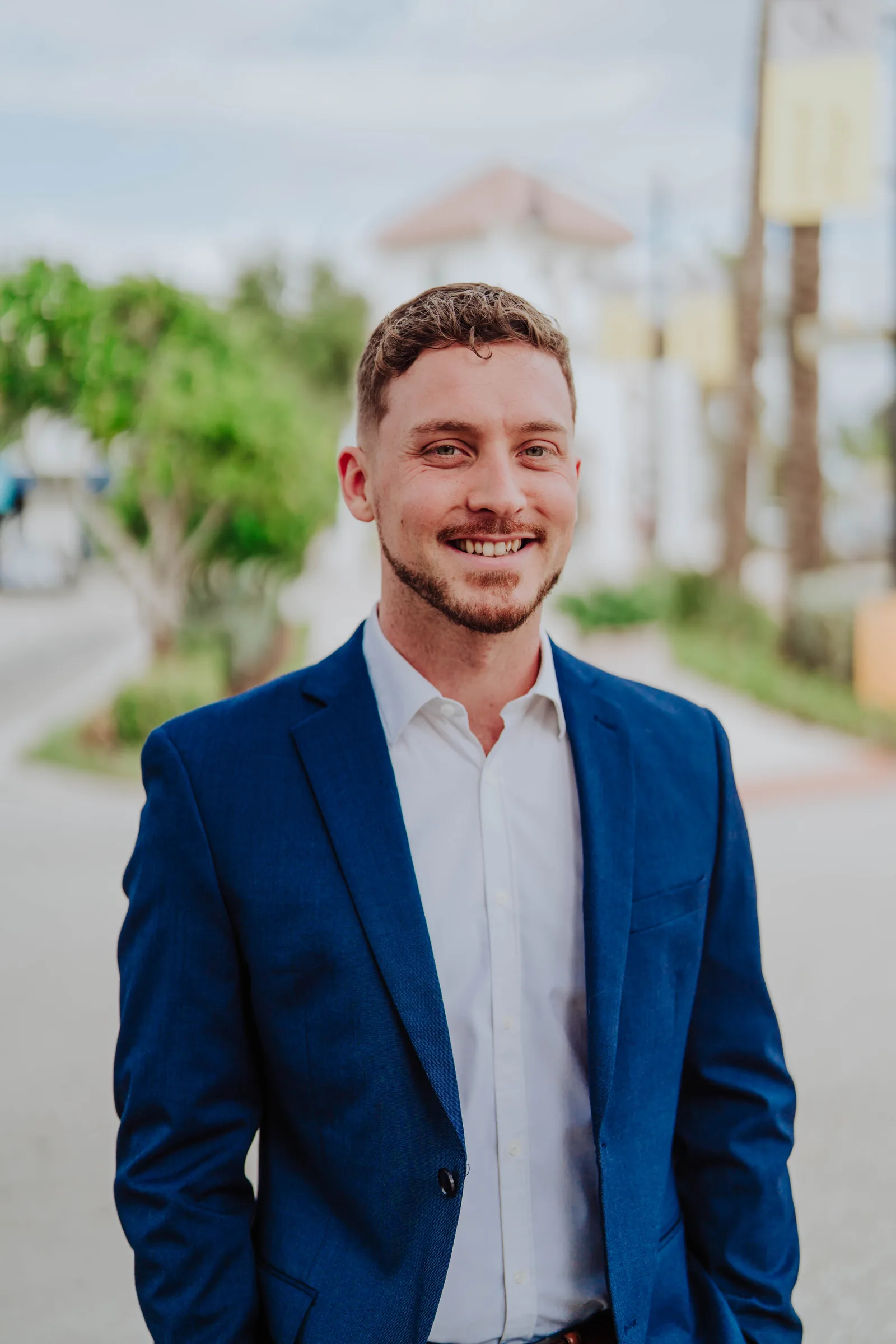 Dr. Jarod Ward smiling in a navy blazer